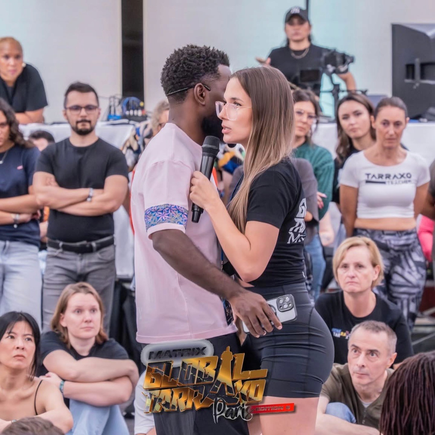 A teacher demonstrating Tarraxo to a workshop, dancers watching